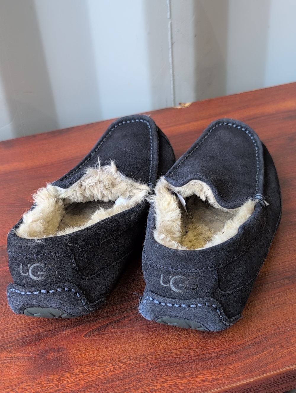 UGG (US-9) Men’s Black Suede Slip-On Moccasins with Shearling Trim